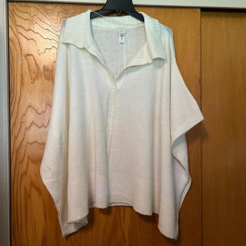 A new day white poncho